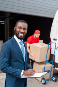 selective focus of multicultural businessman and delivery man