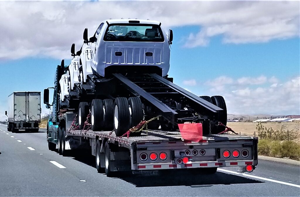 transportation-and-logistics-big-rigs-on-a-flat-b-2025-02-22-04-01-16-utc